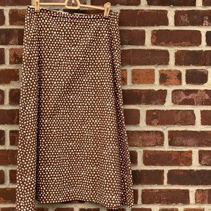 Brown polka dot a line midi skirt. Zip up back.